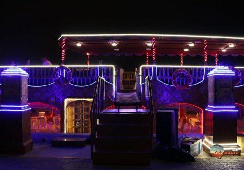 Dhow cruise restaurant in Dubai desert dune