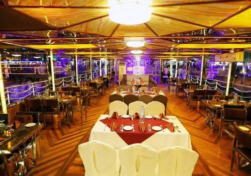 Dhow cruise restaurant in Dubai desert dune