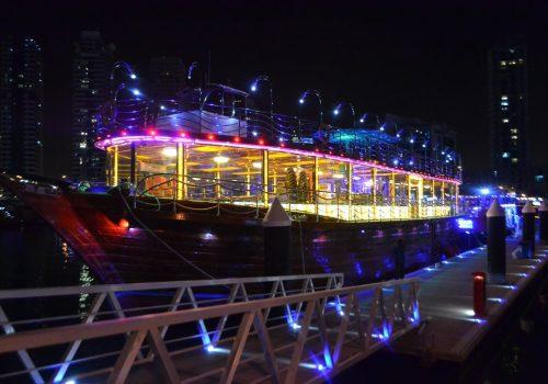 Dhow cruise restaurant in Dubai desert dune