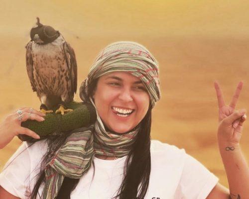 girl-with-falcon in Dubai desert dune image